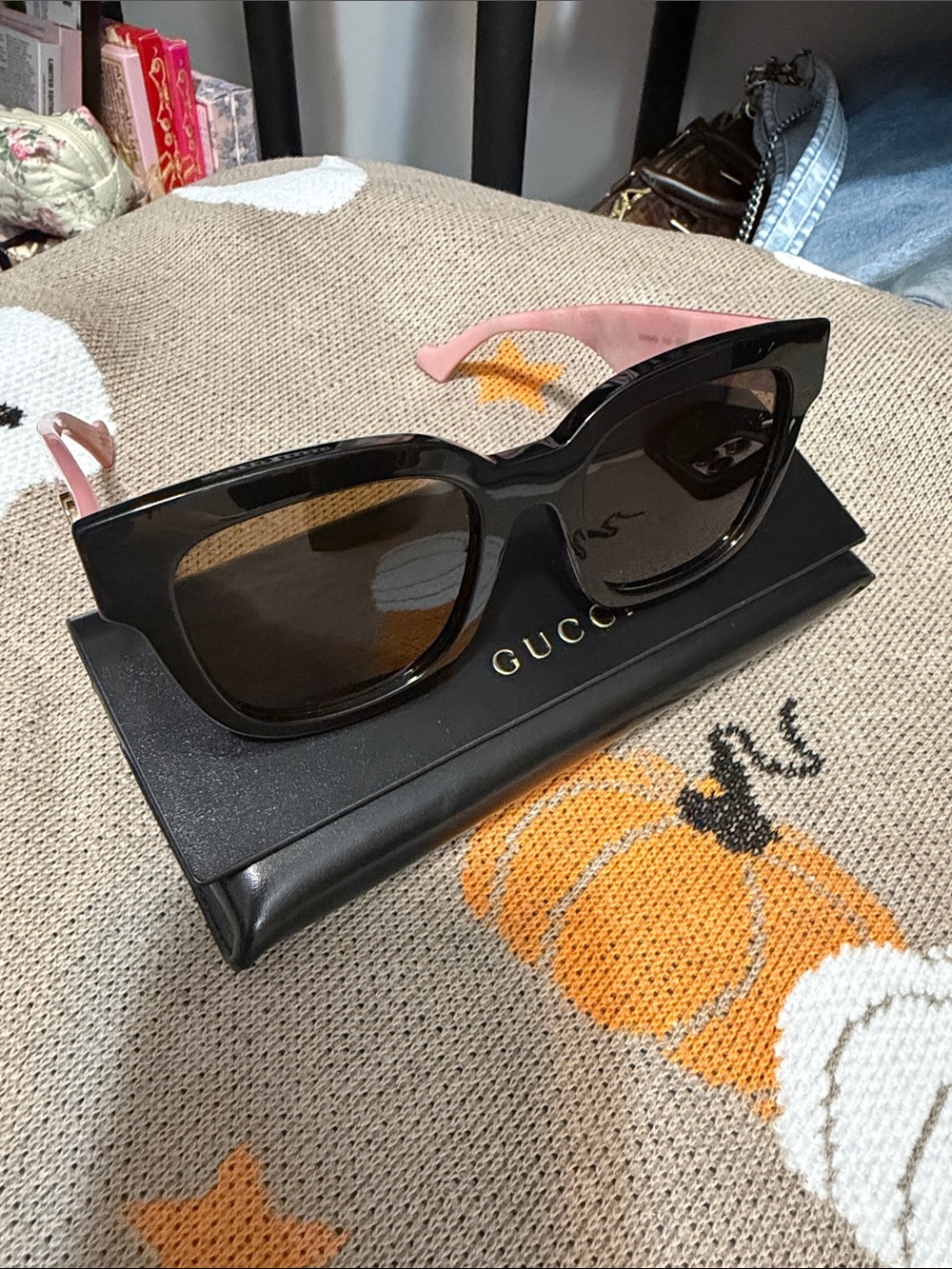 Gucci Black Frame Sunglasses with Pink Temples